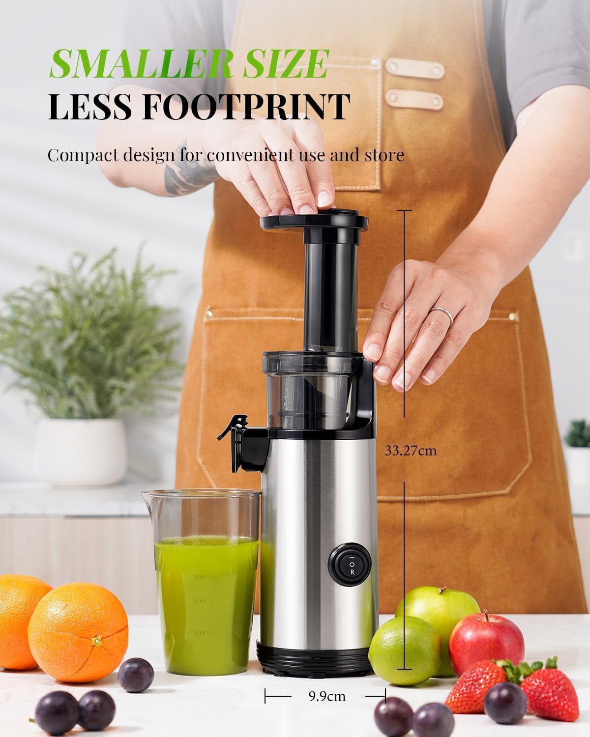 Compact juicer with a glass of green juice, fruits, and measurements on a kitchen counter.