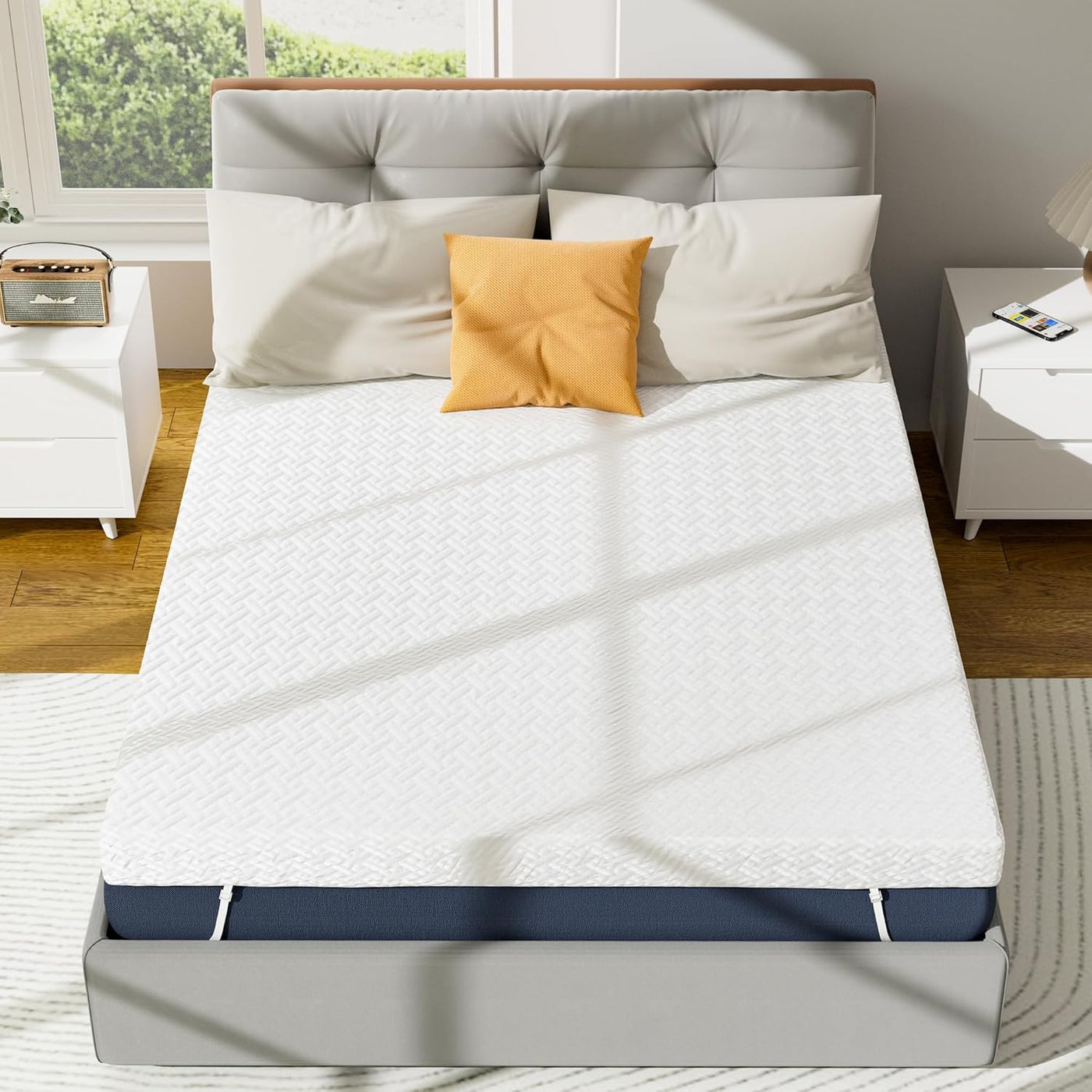 Mattress topper on a bed in a bedroom setting with pillows and a headboard.