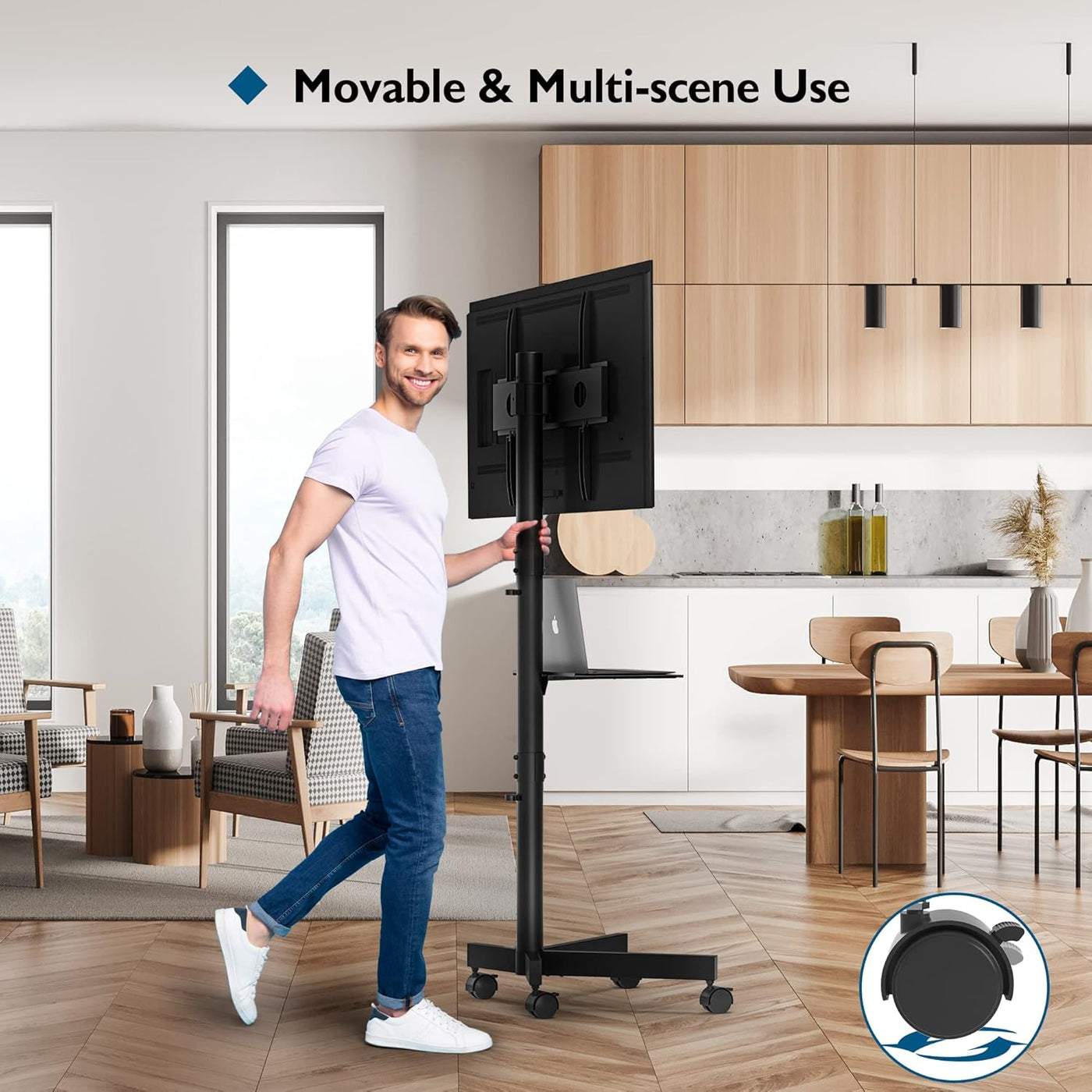 Man using a movable TV stand in a modern kitchen
