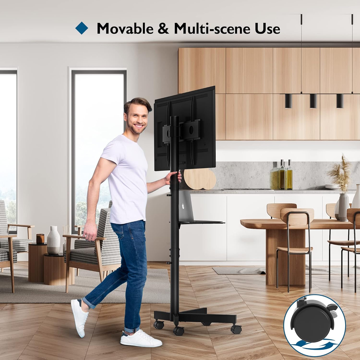 Man using a movable TV stand in a modern kitchen