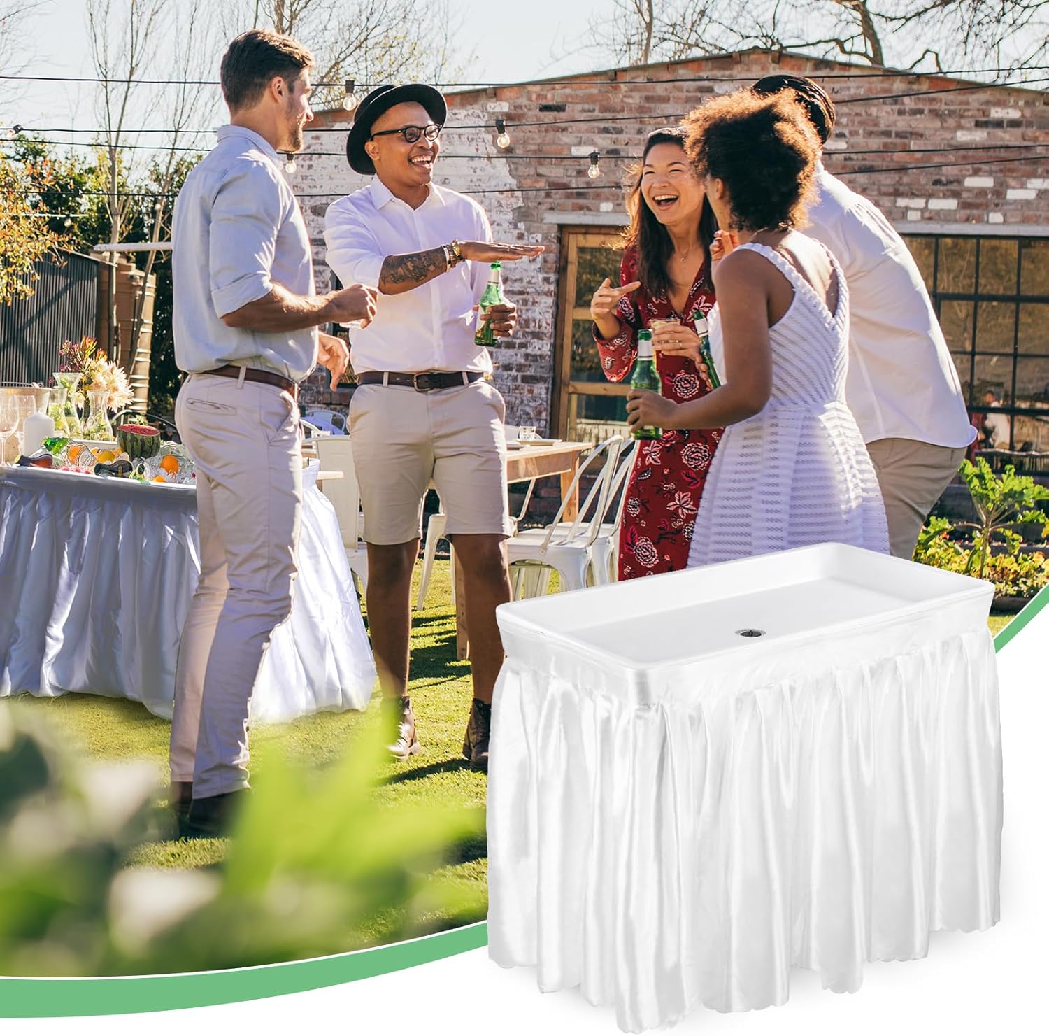 Group of people socializing outdoors at a party with a white portable bar.