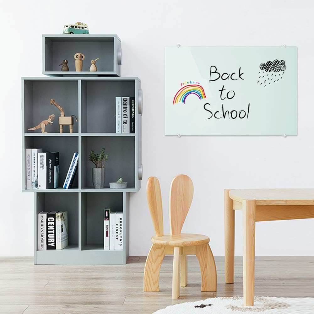 Children's room with a bookshelf, chair, table, and 'Back to School' poster.