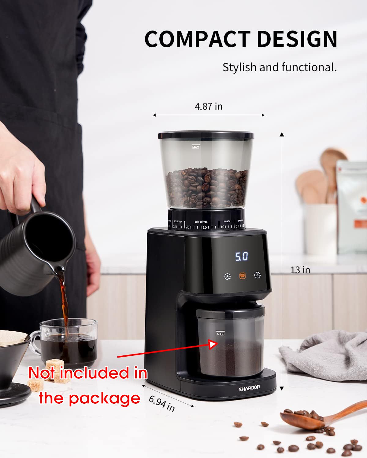 Coffee grinder with digital display on a kitchen counter, showing compact design and dimensions.