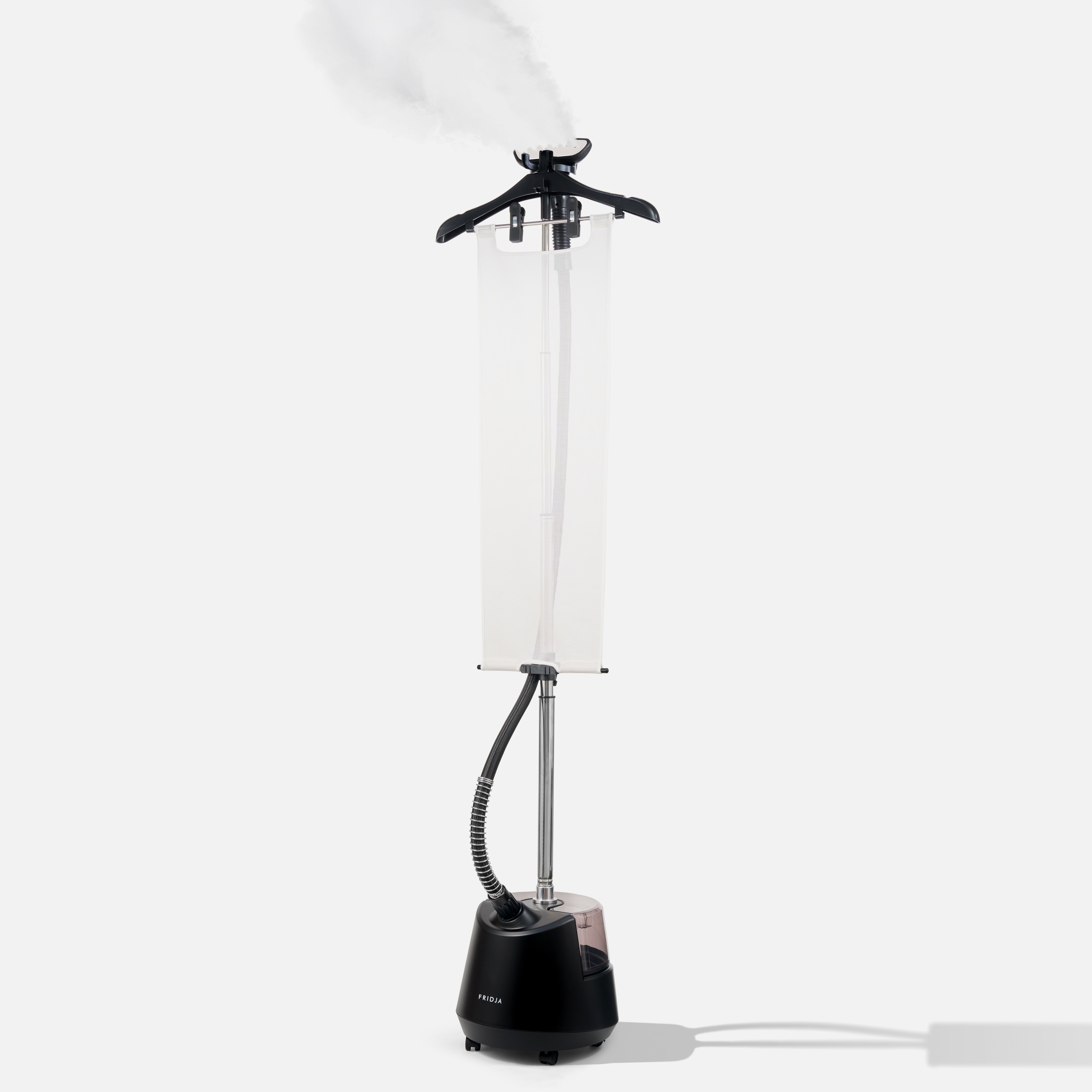 Black garment steamer with a white lampshade on a white background