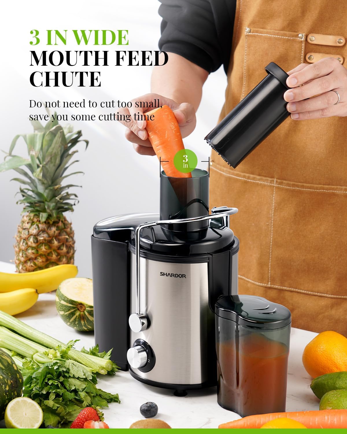Juicer with wide mouth feed chute surrounded by fruits and vegetables on a white background