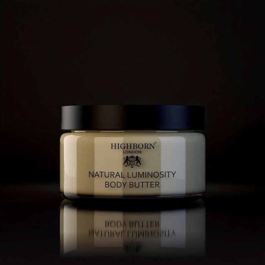Jar of Highborn Natural Luminosity Body Butter on a dark background