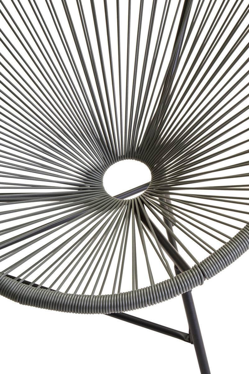 Close-up of a chair with woven design on a white background