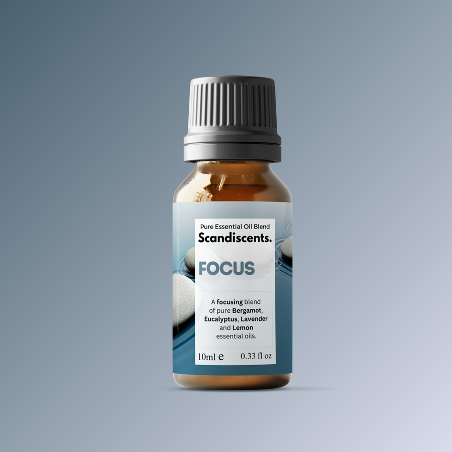 Bottle of Scandiscents Focus essential oil blend on a gray background