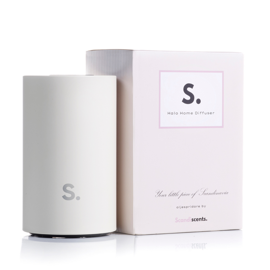 White home diffuser with packaging on a white background