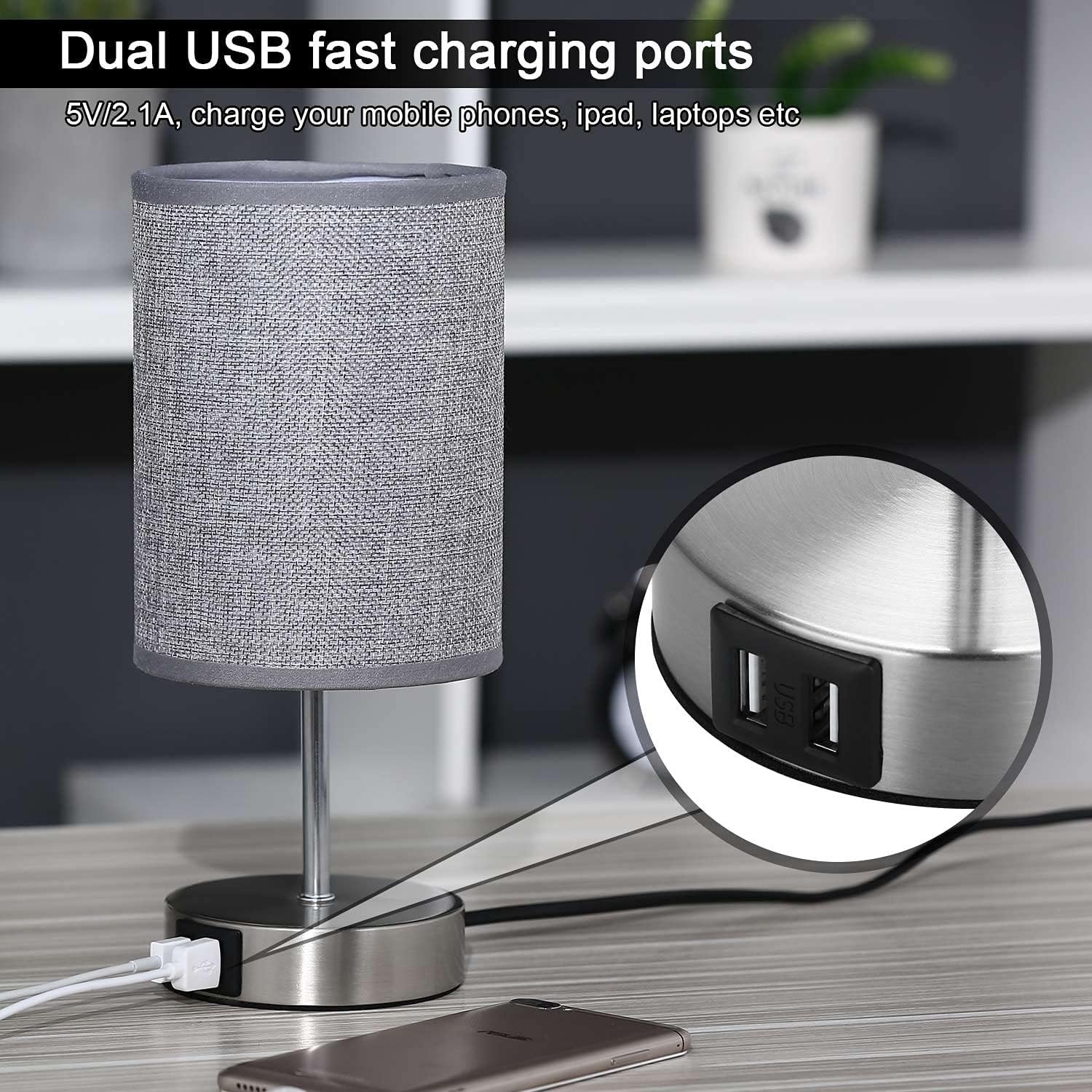 Gray table lamp with dual USB charging ports on a desk.