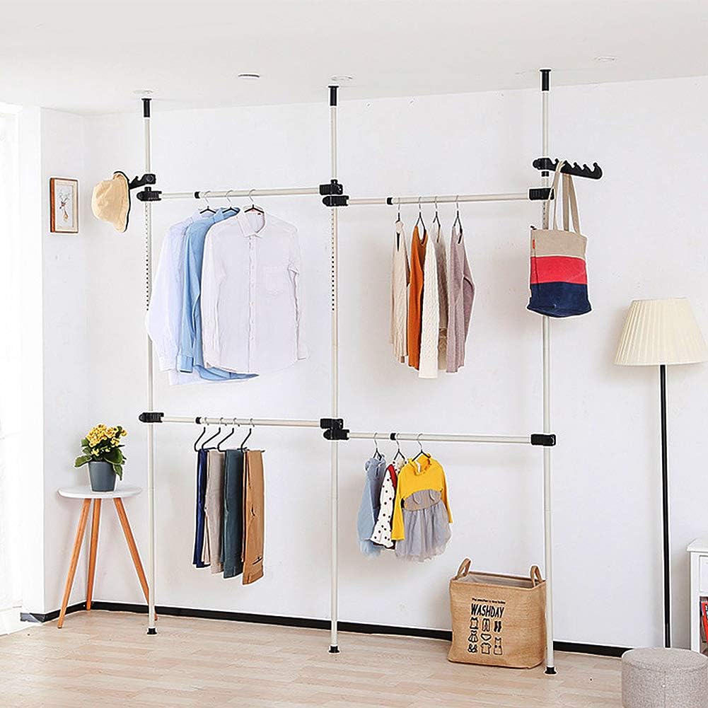 Clothing rack with clothes against a white wall