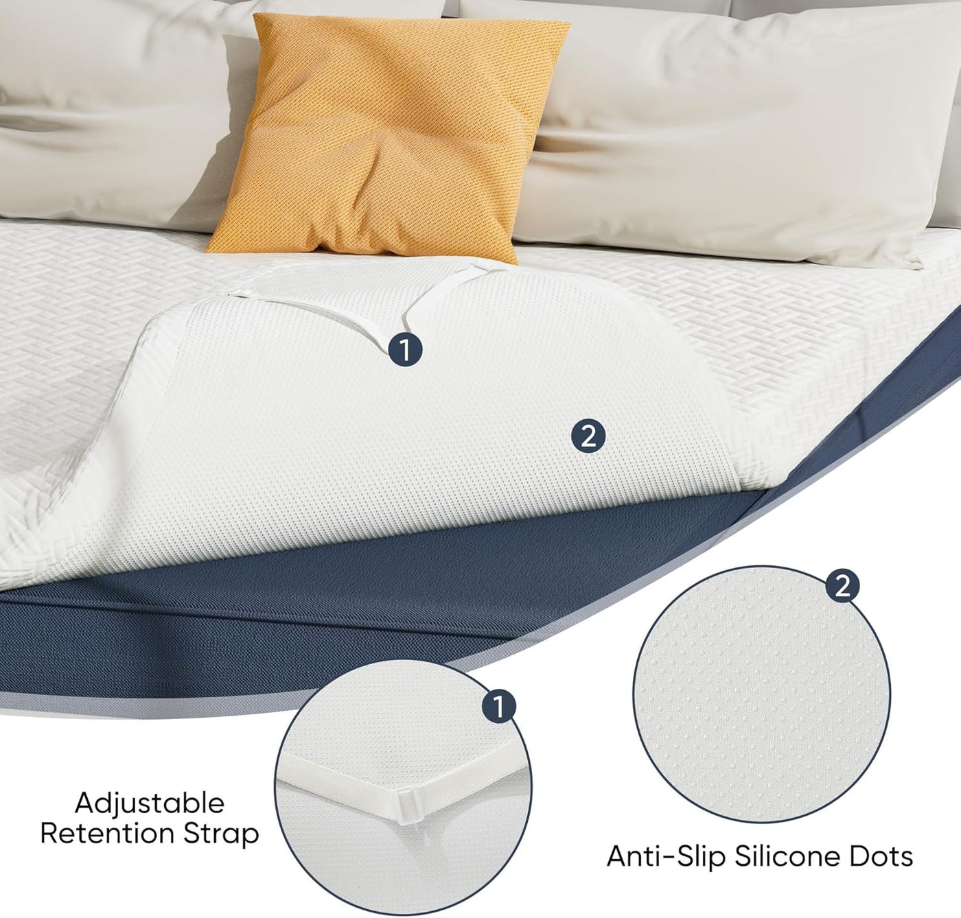 Mattress topper with adjustable retention strap and anti-slip silicone dots on a bed.