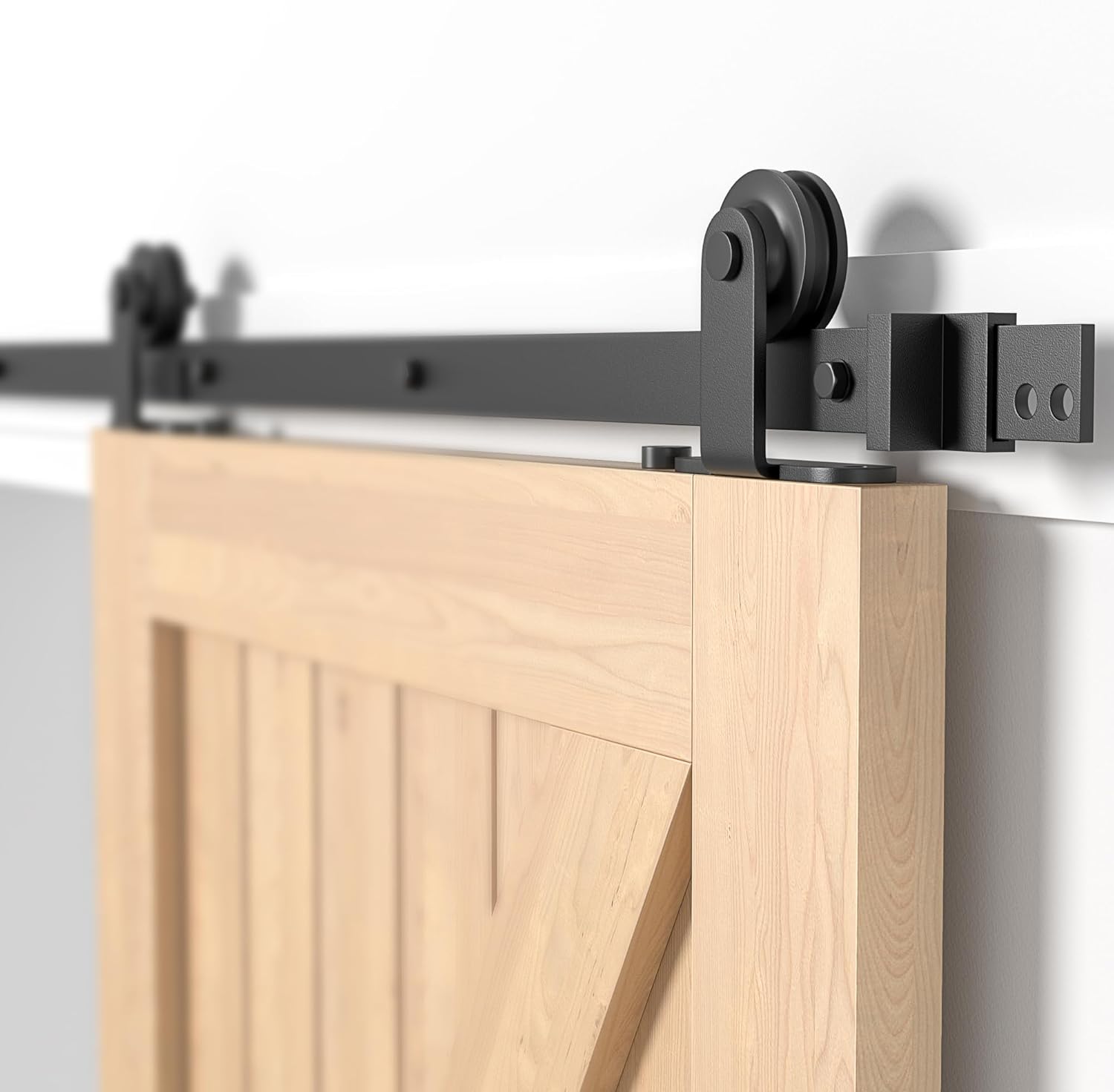 Barn door with black sliding door hardware on a white background