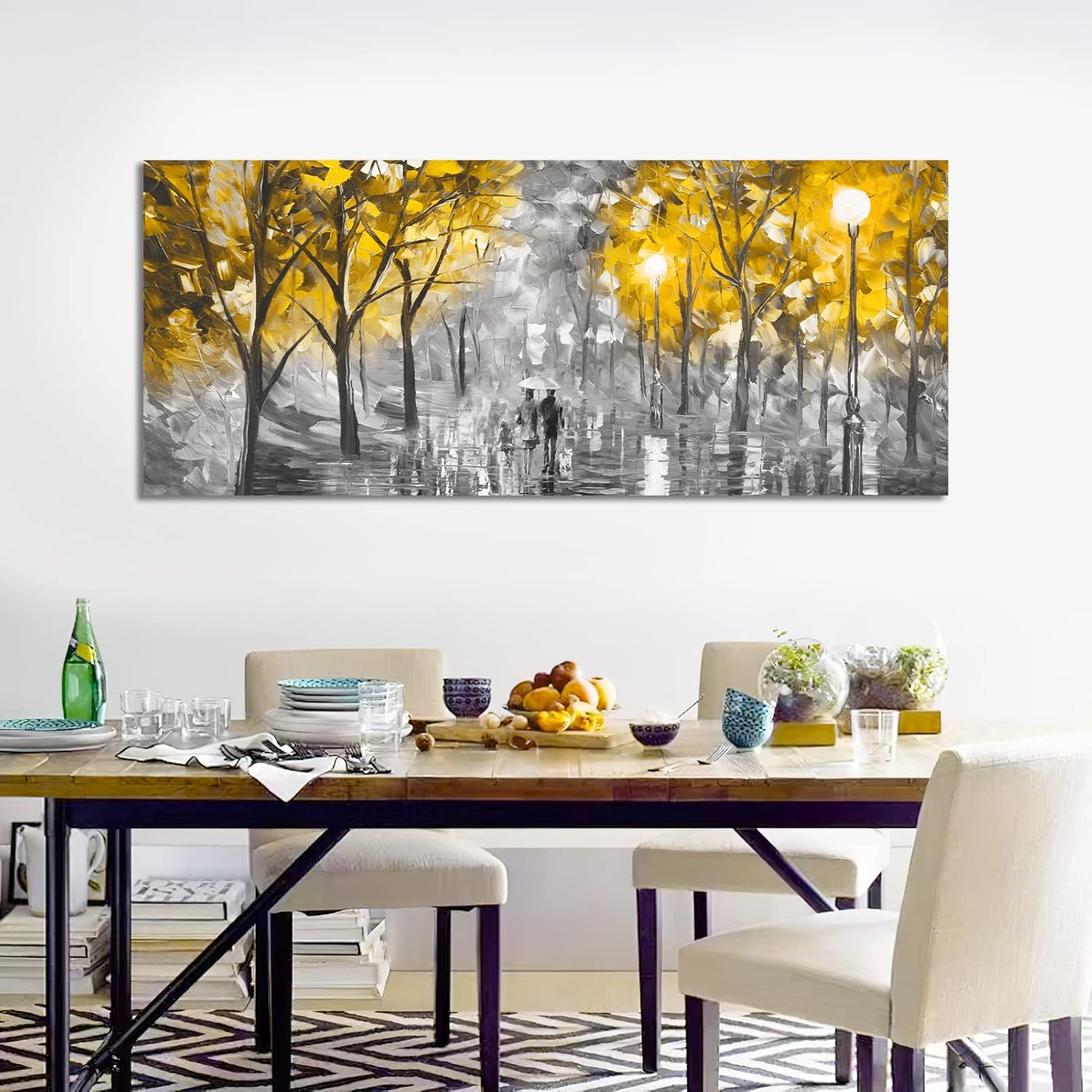 Dining room with a large abstract painting of a forest scene on the wall.
