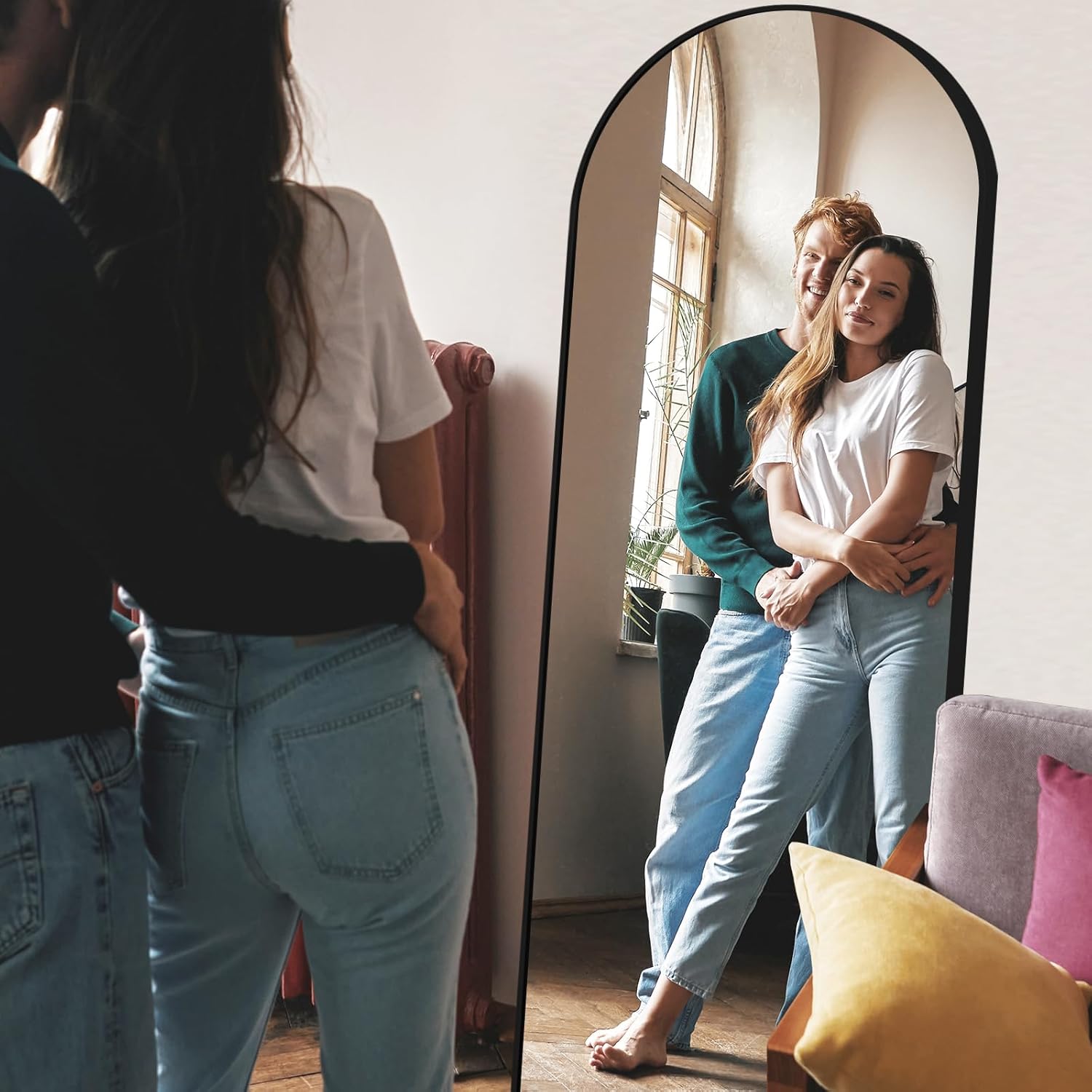 Two people standing in front of a full-length mirror, with one person taking a photo.