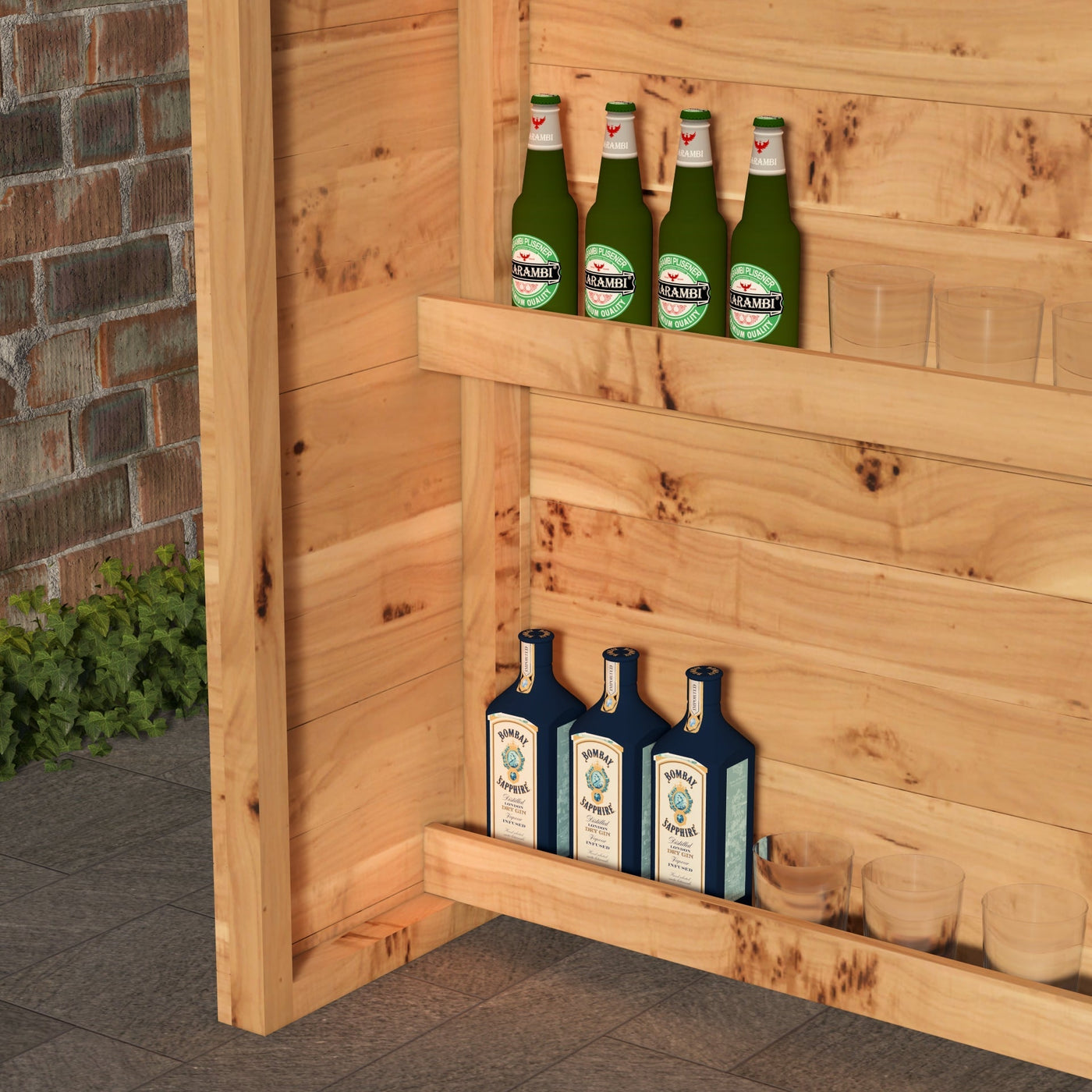 Bottles of Heineken and Bombay Sapphire on a wooden shelf against a brick wall.