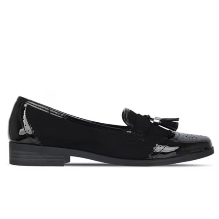 Black patent leather loafer with tassel decoration on the top, featuring brogue-style detailing on the toe and heel.