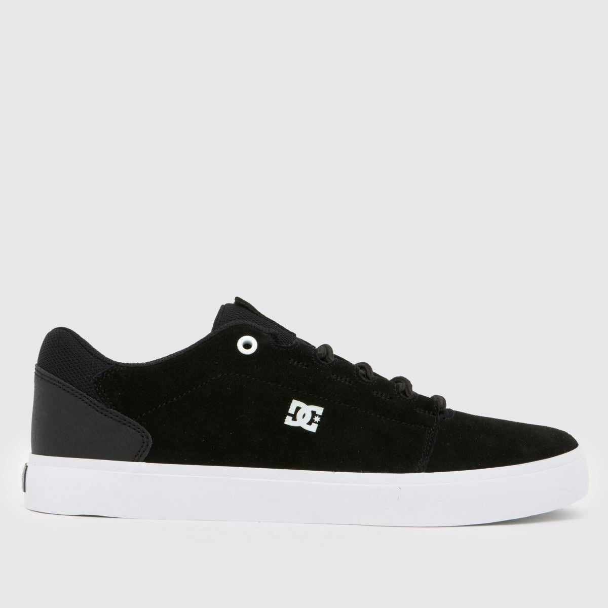 Brown sneaker with white laces and sole on a white background
