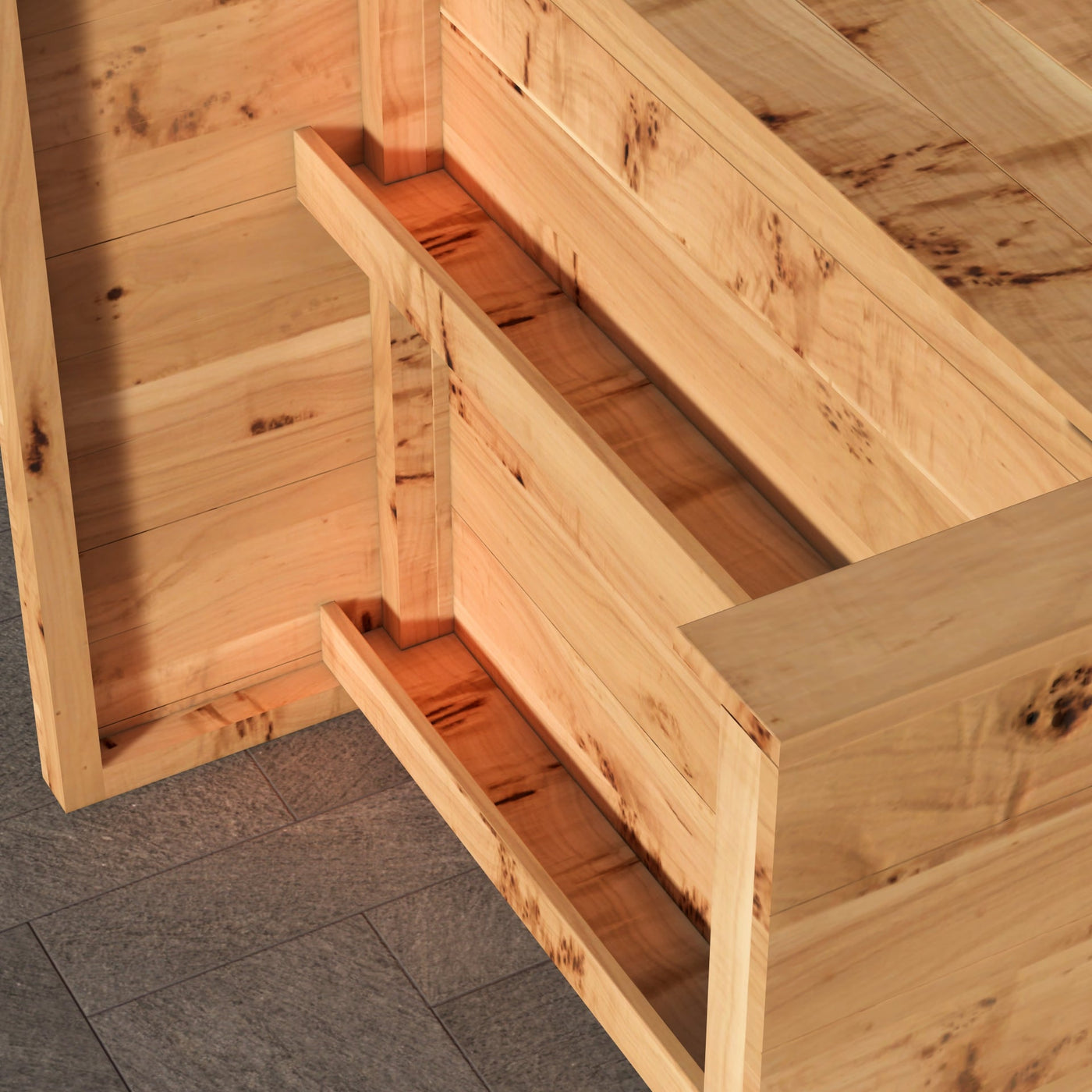 Wooden crate with a handle on a gray floor