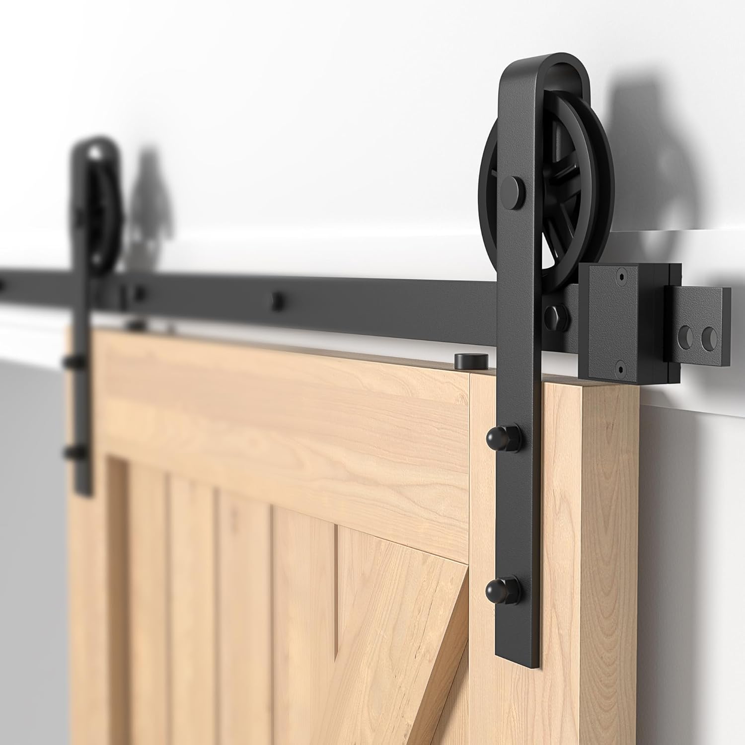 Barn door with black sliding door hardware on a white background