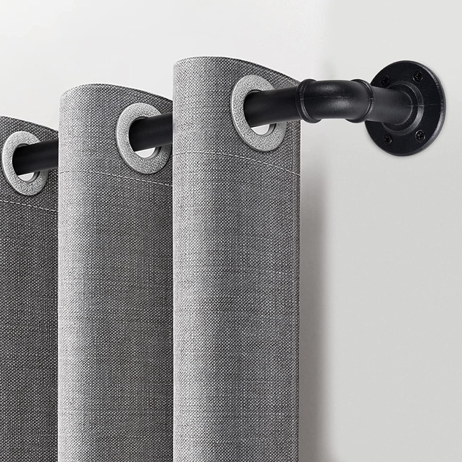 Gray curtains with a black metal curtain rod on a white background