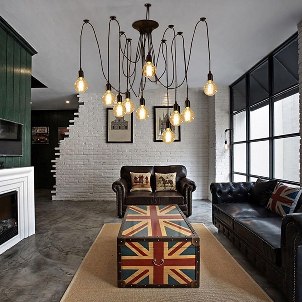 Modern living room with a Union Jack coffee table, leather sofas, and a chandelier.