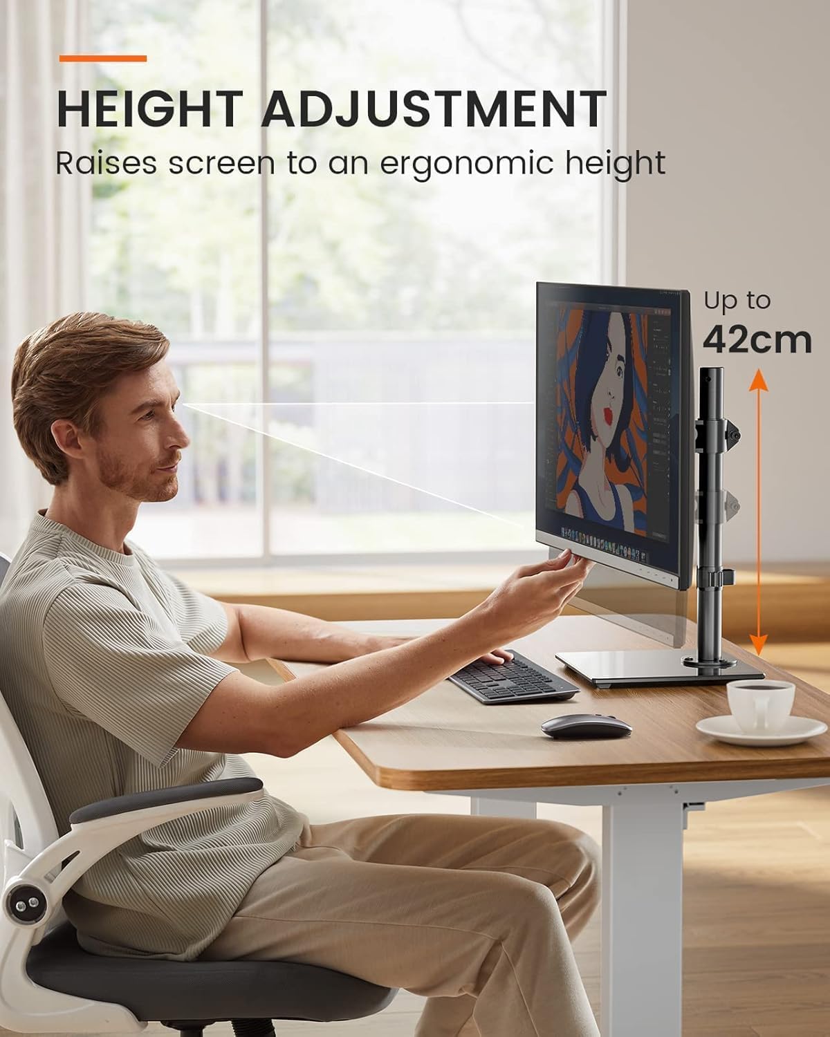 Person using a computer with height adjustment feature, showing screen elevation.