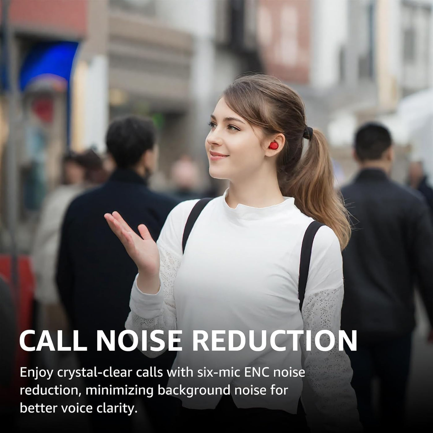 Woman wearing earphones in a busy urban setting with text about call noise reduction.