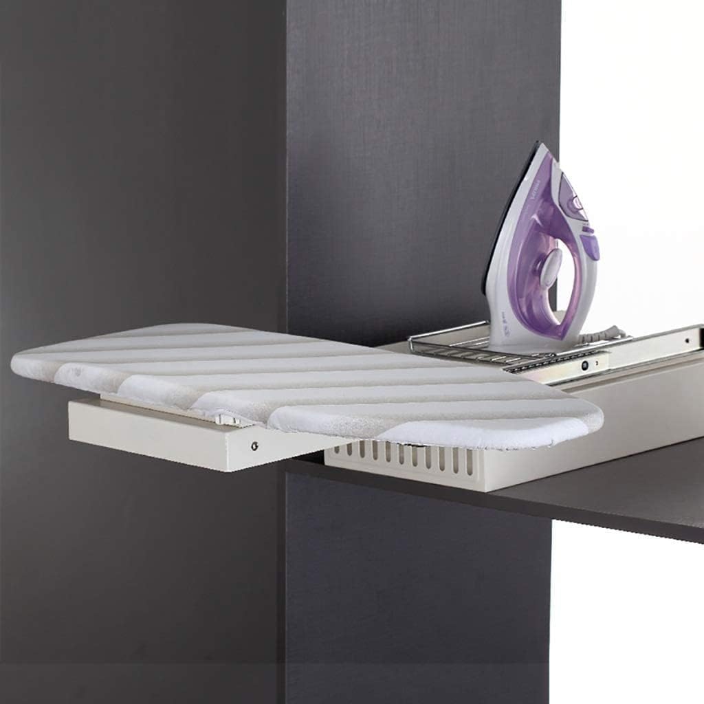 White ironing board attached to a dark wall with a purple iron on top.