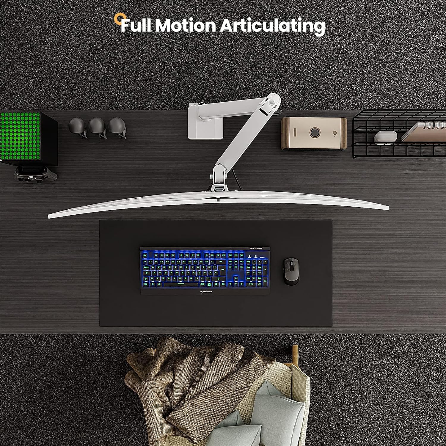 Monitor stand with full motion articulating arm on a desk setup.