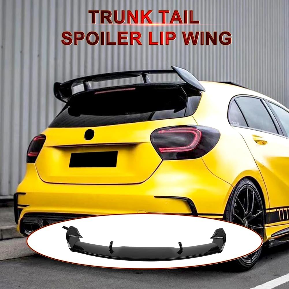Yellow car with a trunk tail spoiler lip wing attachment on a gray background