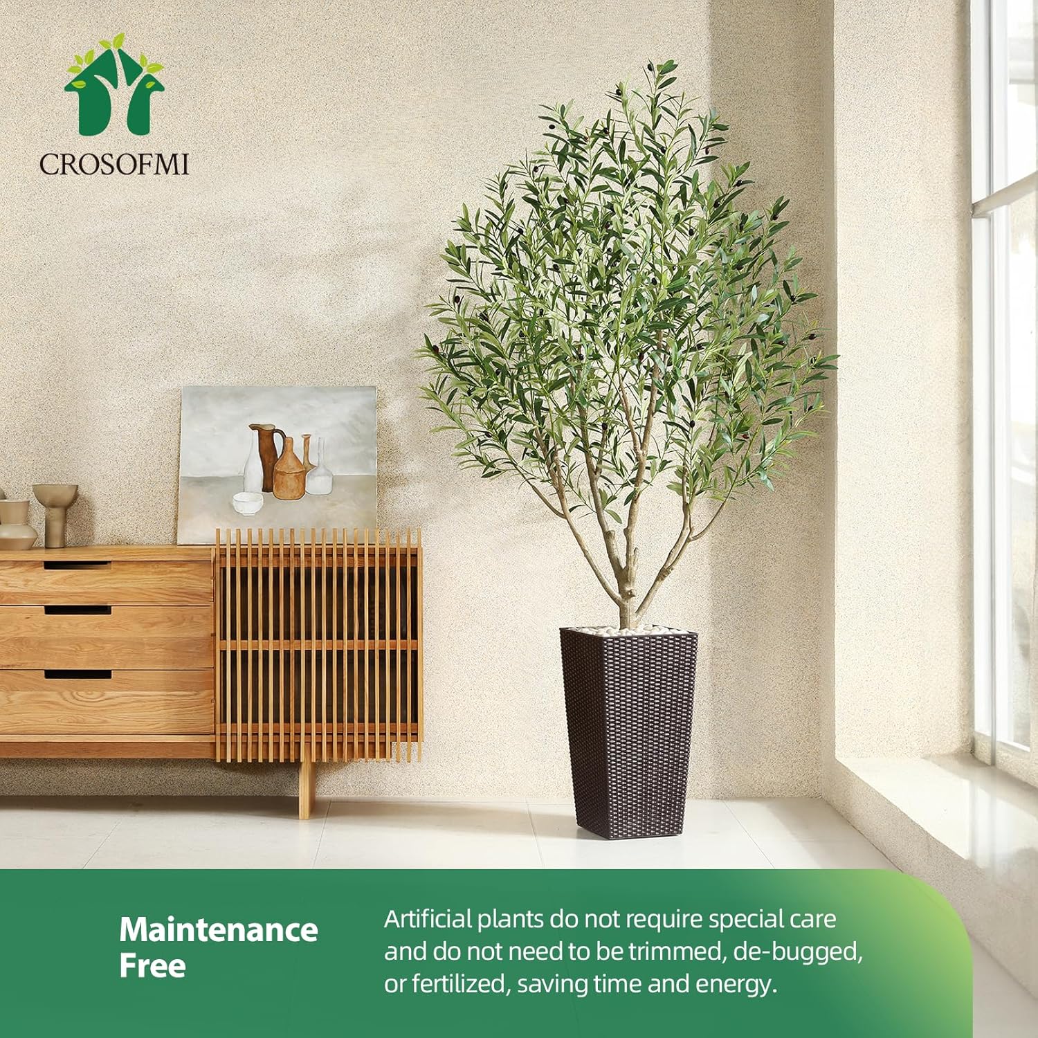 Artificial plant in a room with a wooden cabinet and a window, featuring the CROSOFMI brand.