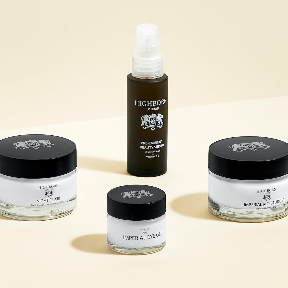 Highborn skincare products including serum, night elixir, eye gel, and moisturizer on a beige background