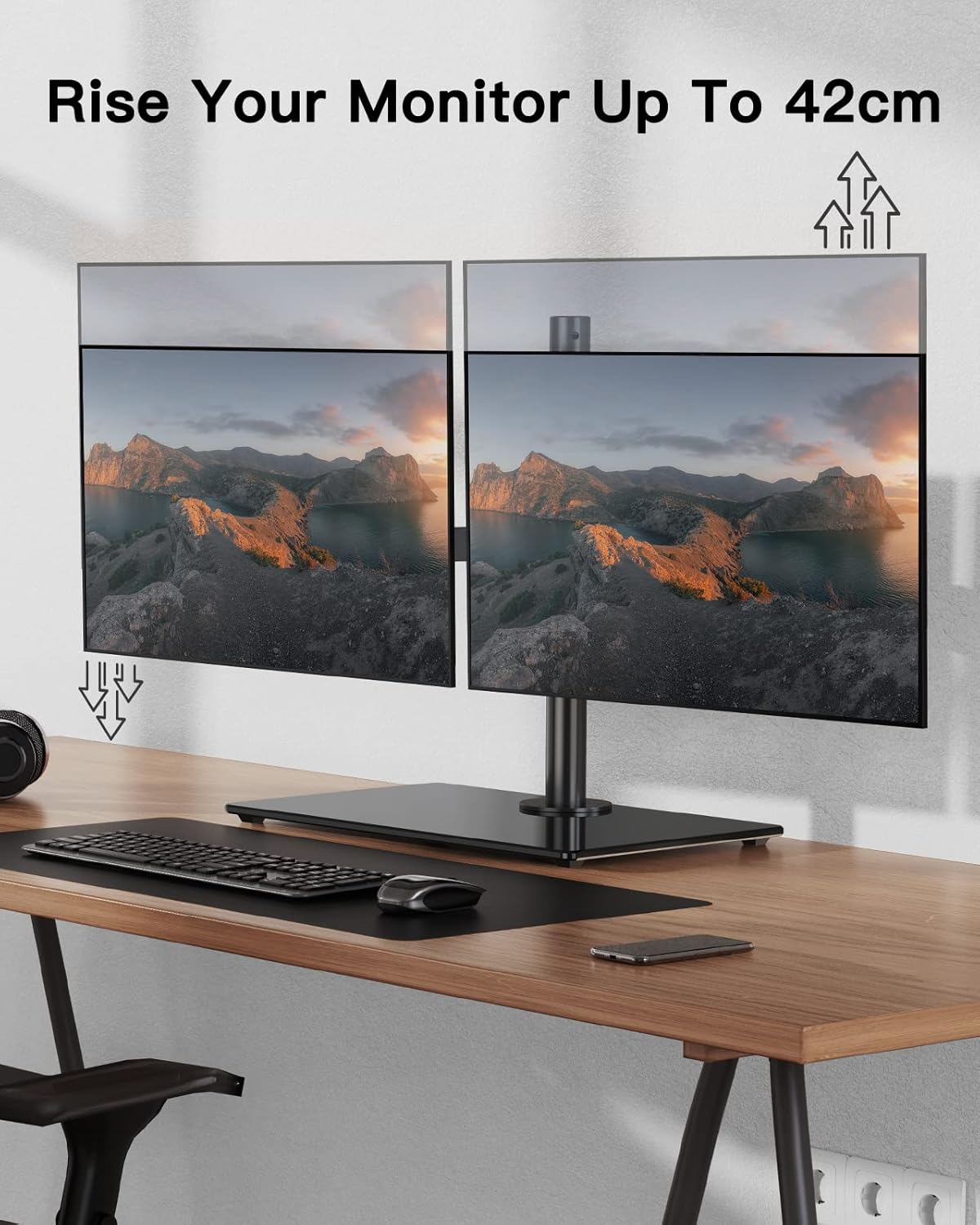 Two monitors on a desk with a keyboard and mouse, featuring text about monitor height adjustment.
