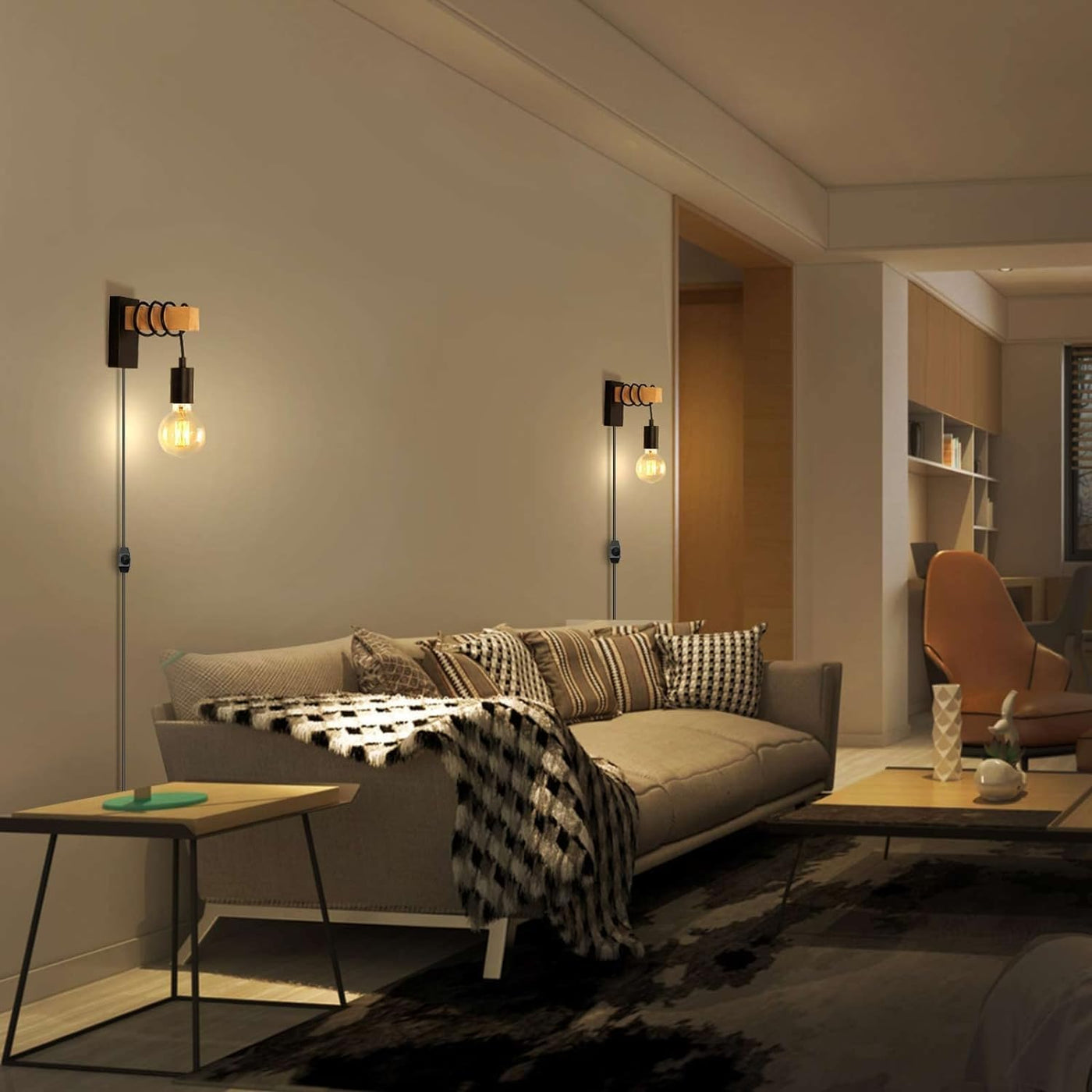 Modern living room with a gray sofa, decorative pillows, and wall lights.
