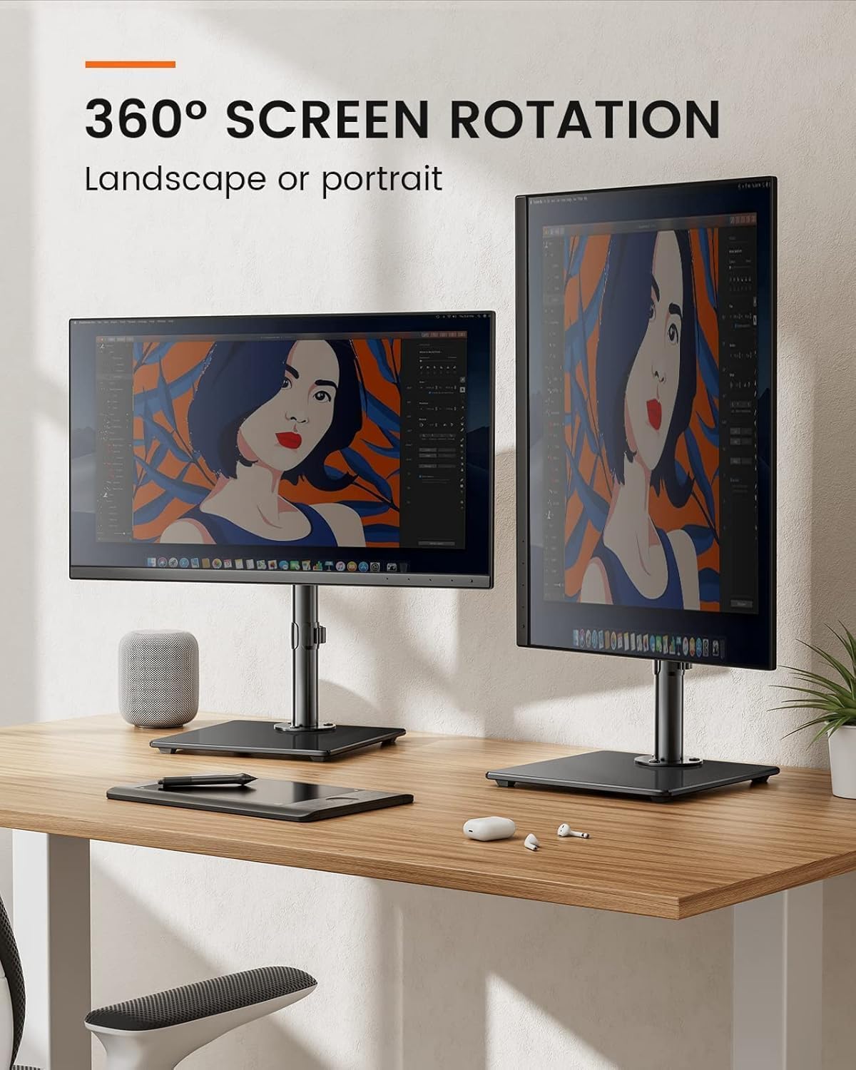 Two monitors on a desk with 360-degree screen rotation feature, displaying artwork.