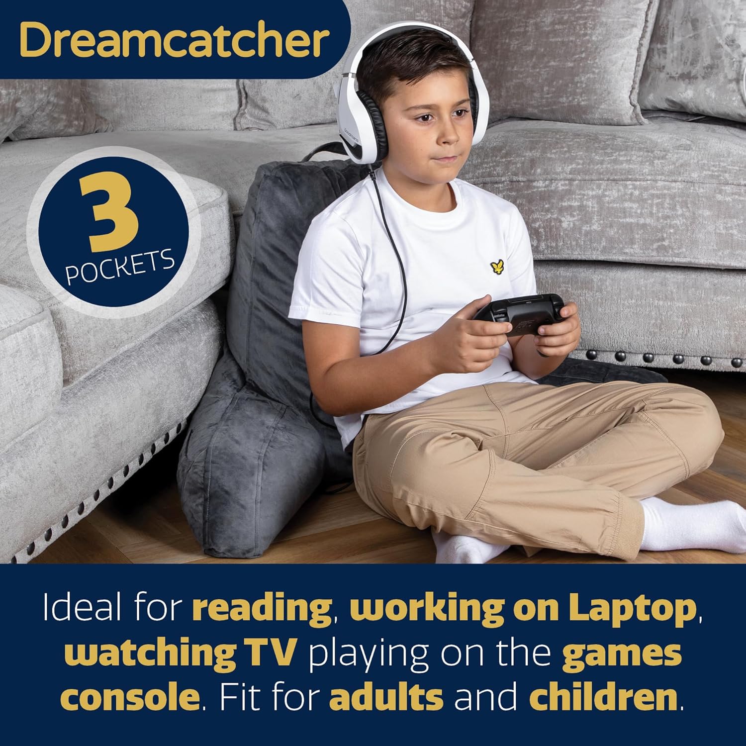 Child playing a game with headphones, sitting on a couch with a Dreamcatcher product advertisement.
