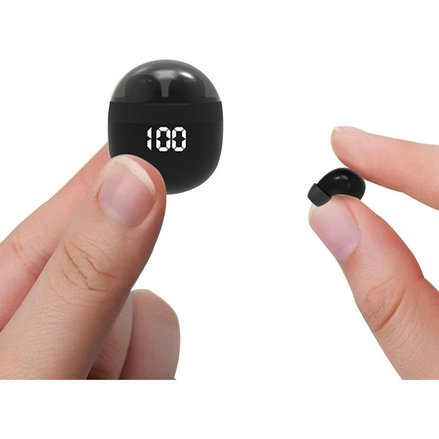 Small black electronic device with digital display held between fingers on a white background