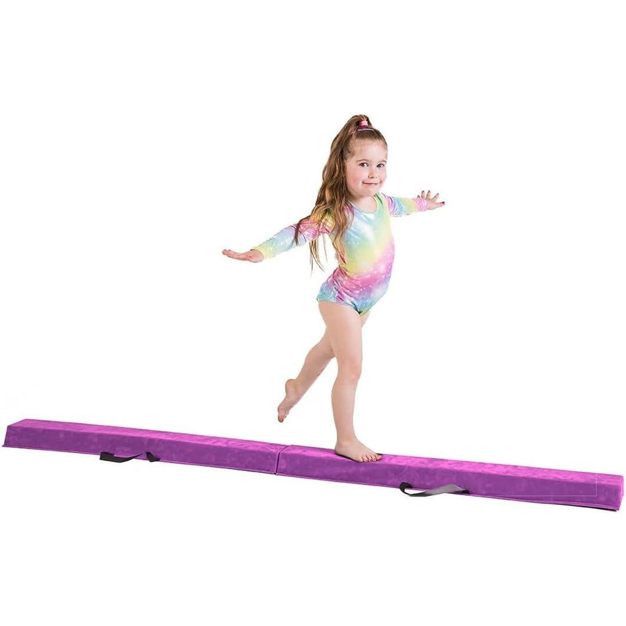 Child in a colorful leotard standing on a purple balance beam against a white background