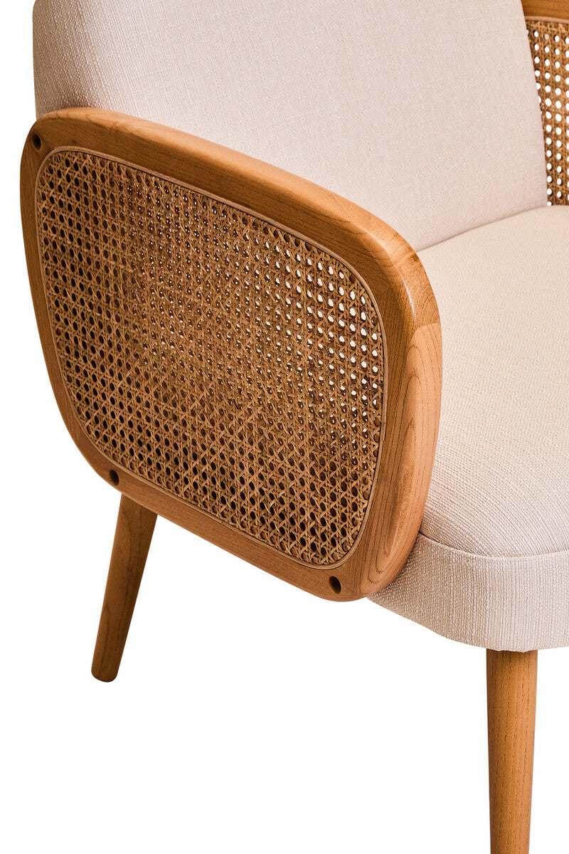 Chair with wicker backrest and beige cushion on a white background