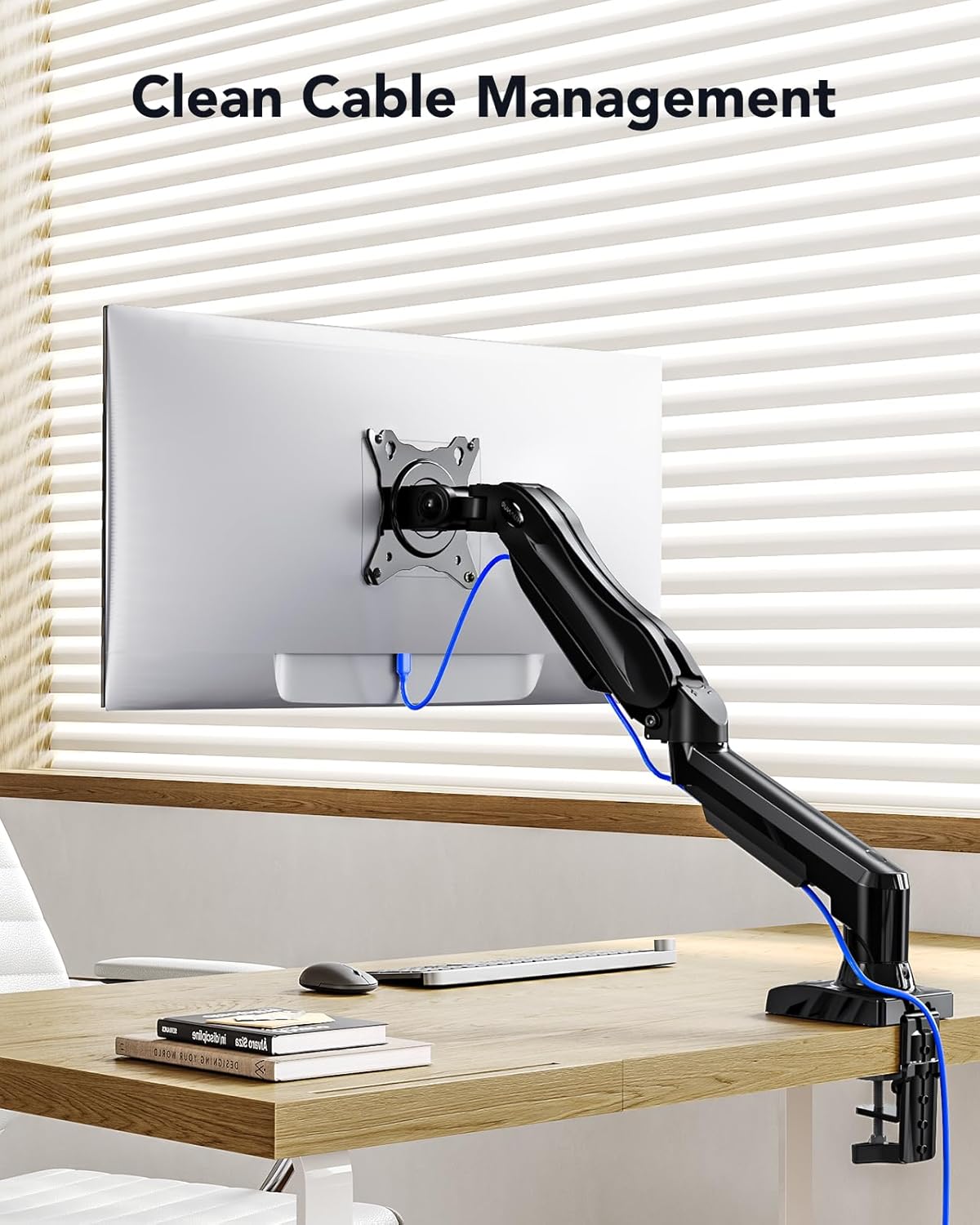 Monitor mount with clean cable management on a desk