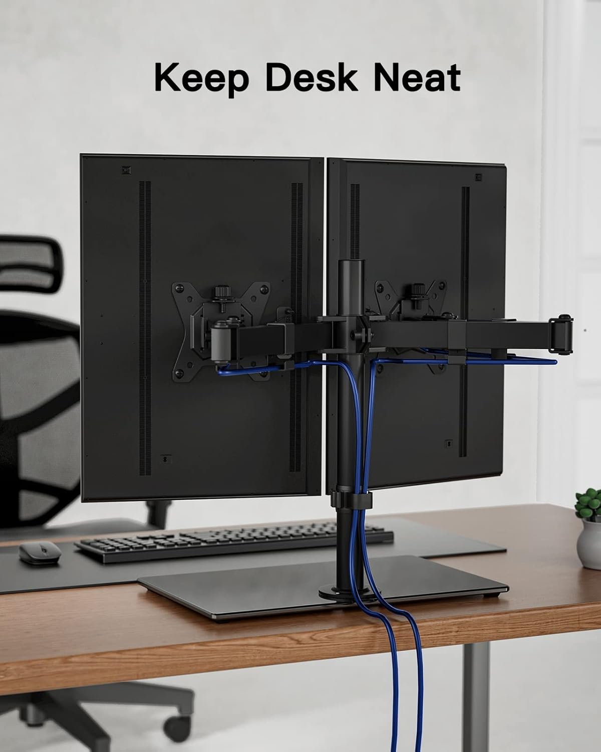 Dual monitor setup on a desk with a cable management system, text 'Keep Desk Neat' above.