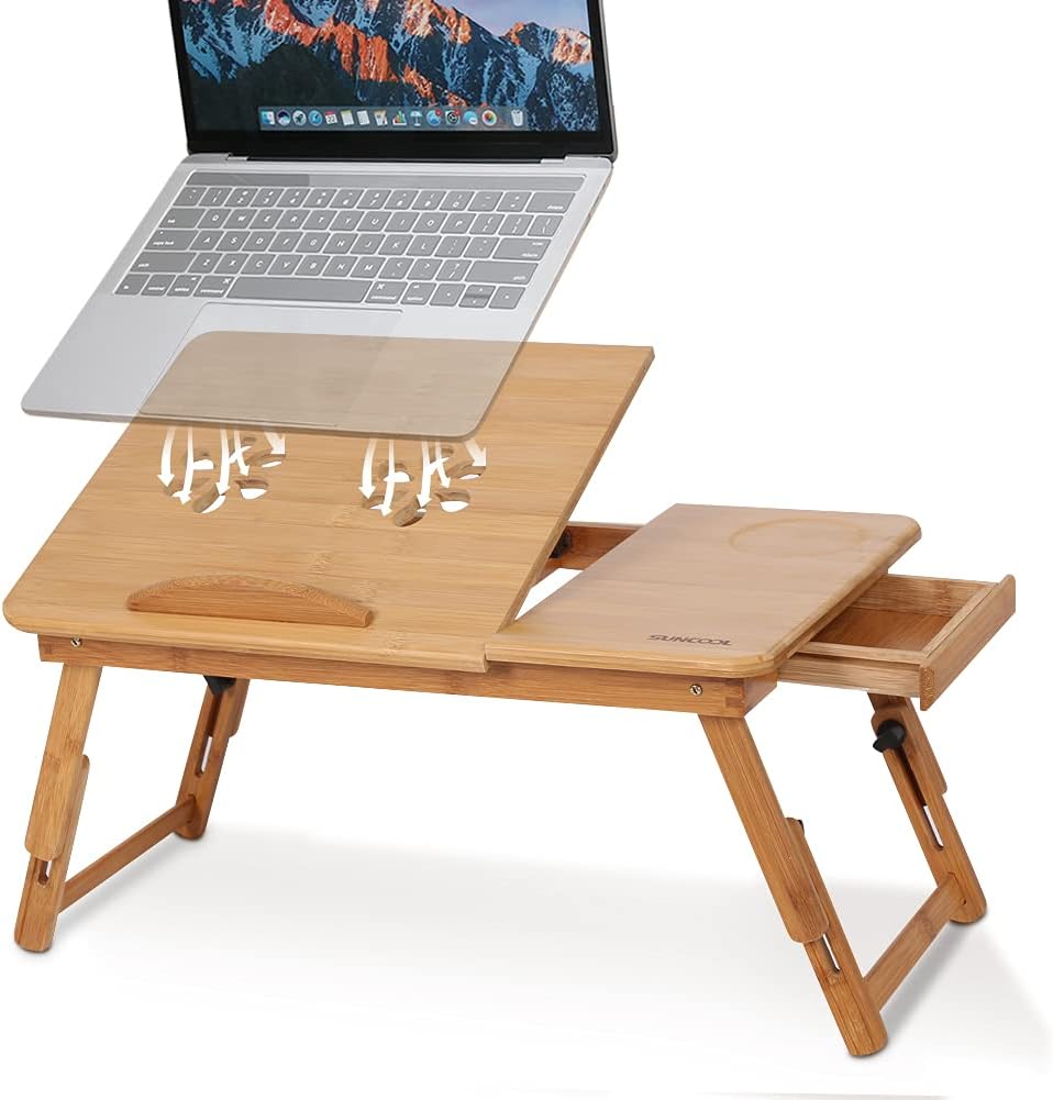 Wooden laptop desk with a laptop on top, on a white background