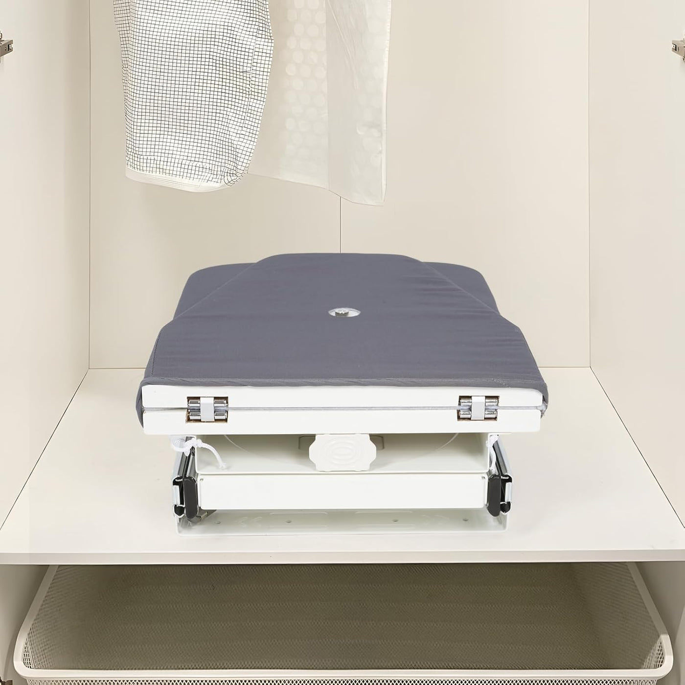 Gray massage table in a clinical setting with a white background
