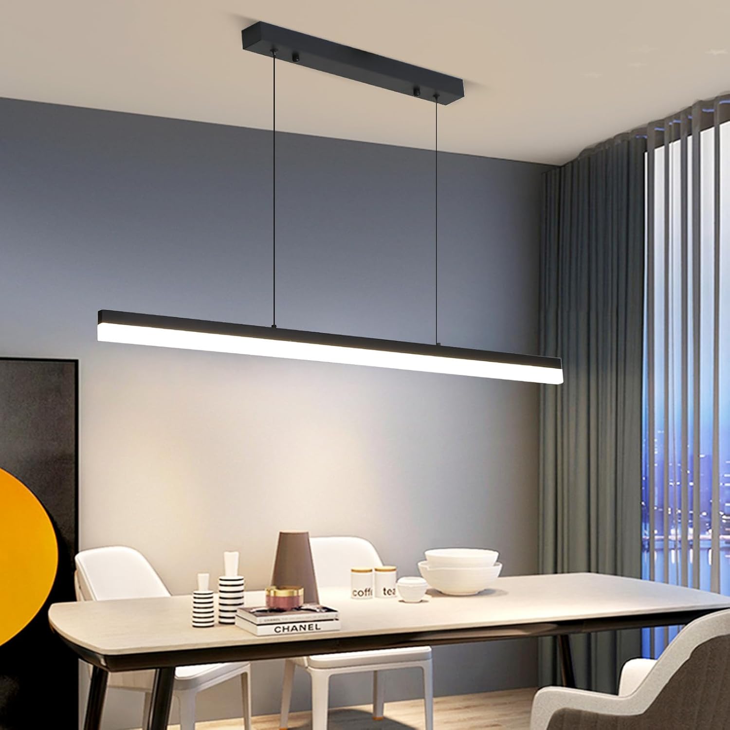 Modern dining room with a long rectangular pendant light fixture.