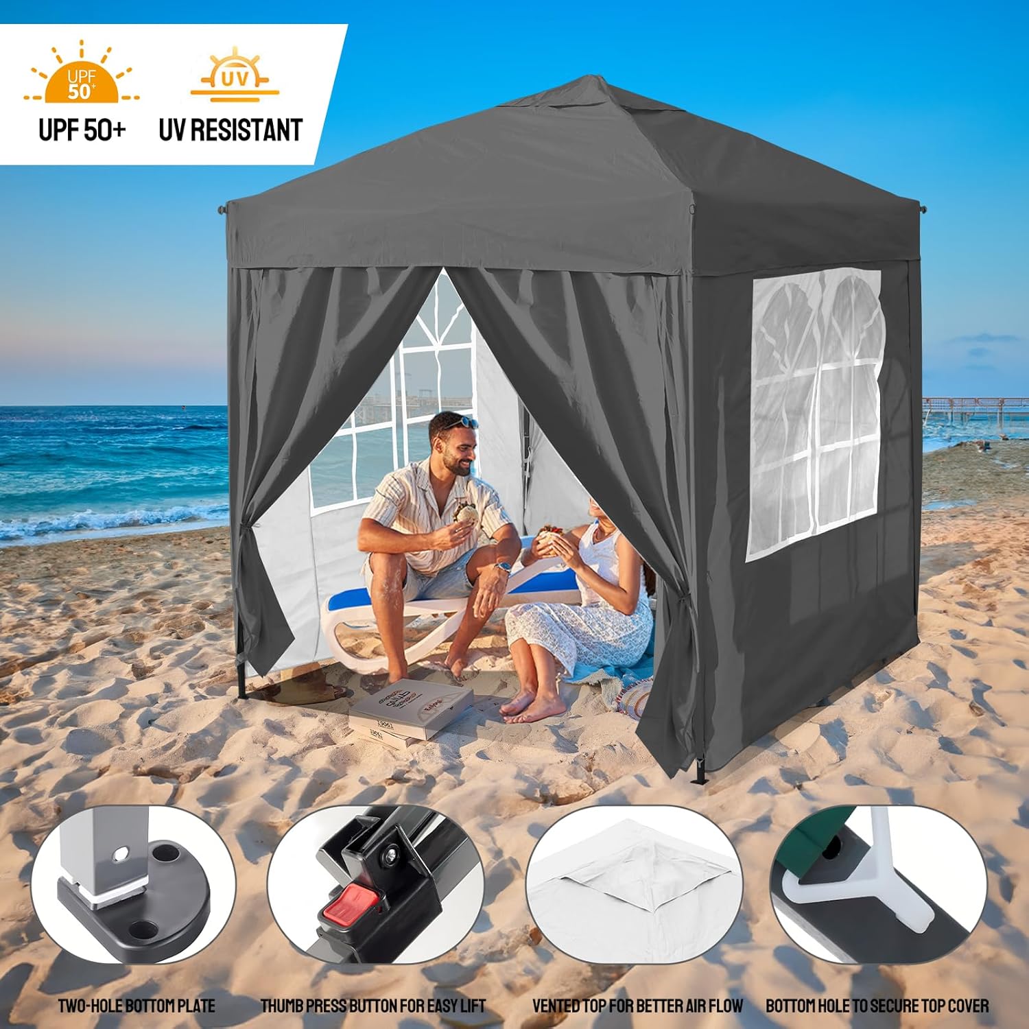 Black pop-up canopy tent on a beach with people using it, featuring UPF 50+ and UV resistance labels.