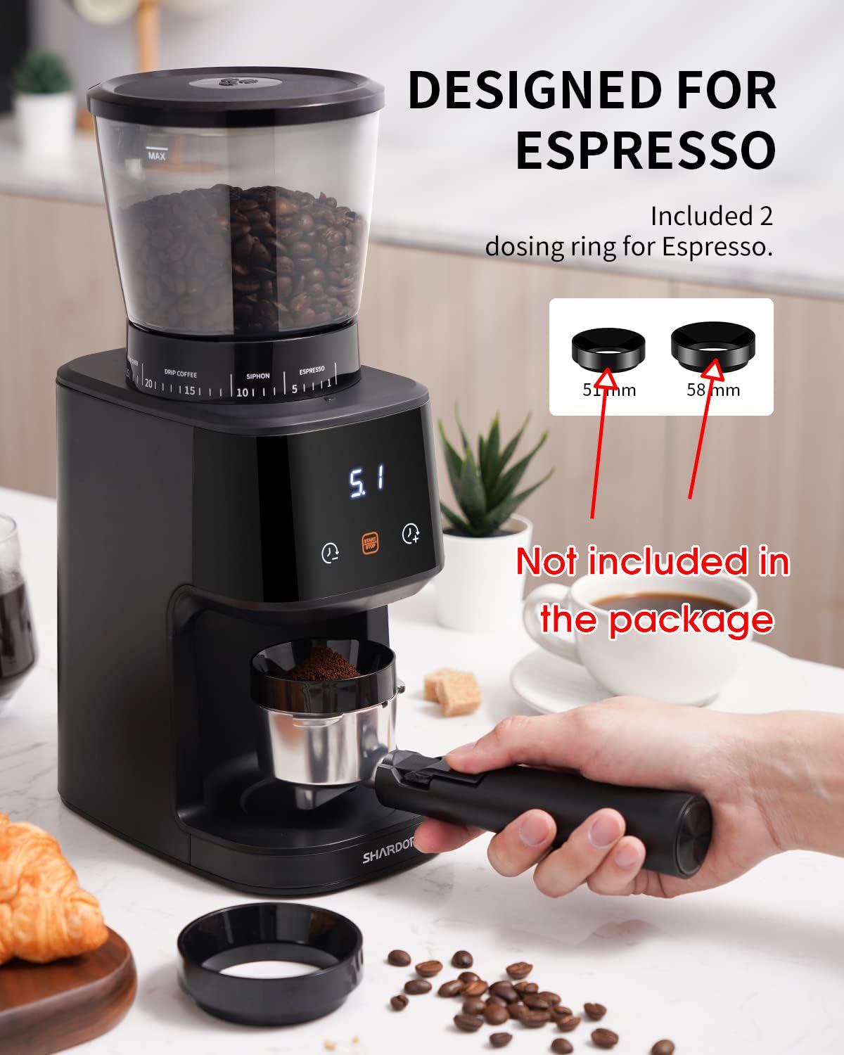 Black coffee grinder with digital display on a kitchen counter, featuring text about espresso design.