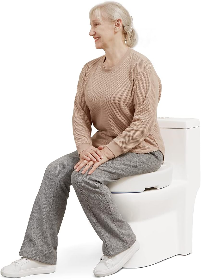 Woman sitting on a toilet with a cushioned seat cover on a white background