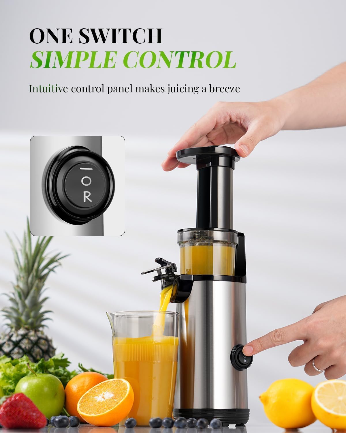 Juicer with a control panel being used, surrounded by fruits and vegetables on a light background.