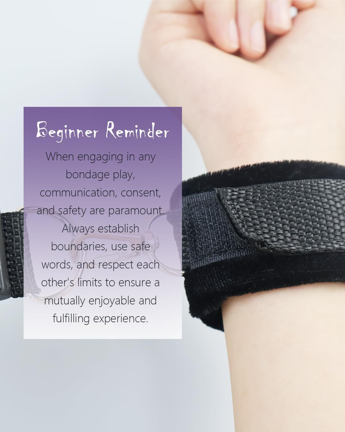 Hand wearing a black restraint with a text overlay on a light background